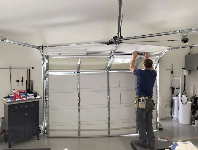 Winthrop Garage Door Repair specialist performing precise section replacement on Winthrop garage door